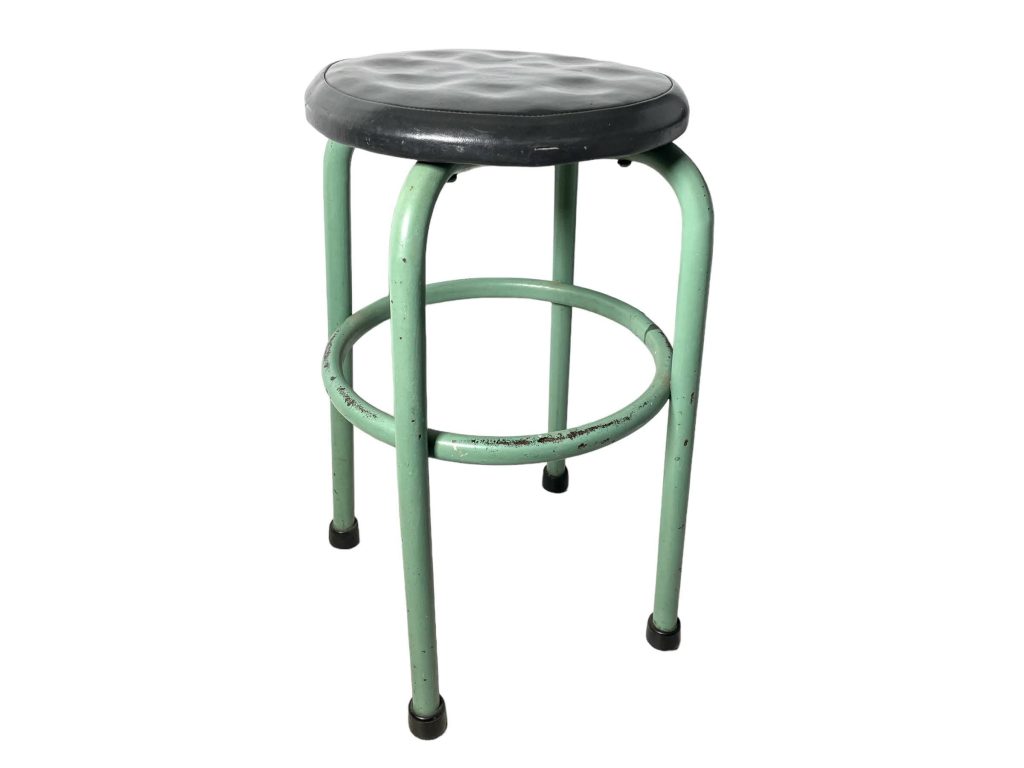 Vintage French green metal stool with padded black seat